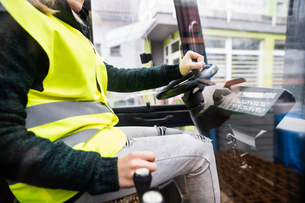 Woman forklift truck driver in an industrial area. drug-free workplace for employees